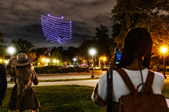 300 drones in the night sky above Philadelphia make the shape of the Penn shield